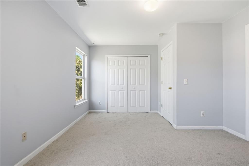 585 McWilliams Road Southeast, Unit 2402 Atlanta, GA 30315 - Photo 22 of 25 a view of an empty room with a window