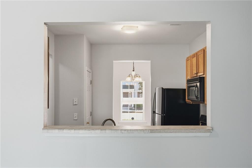 585 McWilliams Road Southeast, Unit 2402 Atlanta, GA 30315 - Photo 8 of 25 a view of a sink a mirror and a window