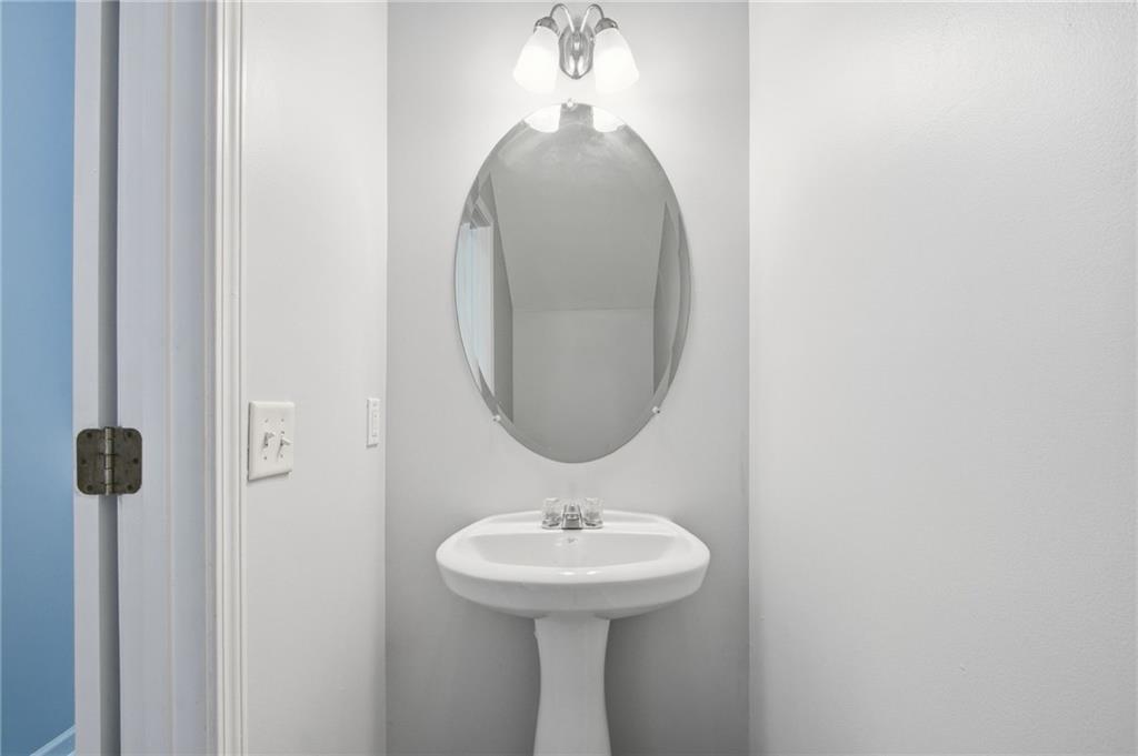 585 McWilliams Road Southeast, Unit 2402 Atlanta, GA 30315 - Photo 10 of 25 a bathroom with a sink a mirror and a window