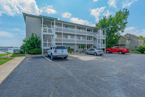 a building with cars parked in front of it
