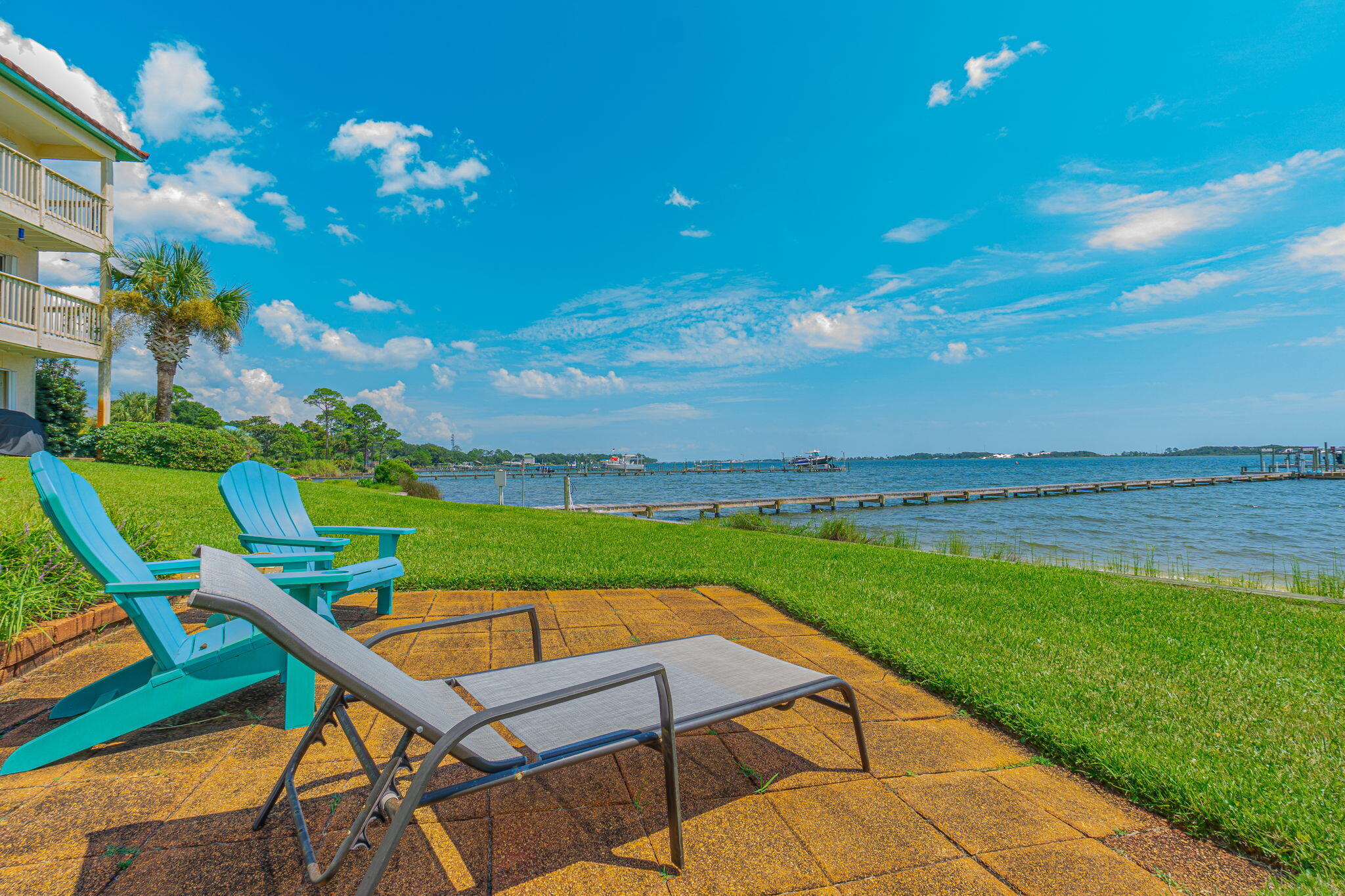 1695 Highway 98, Unit 102 Mary Esther, FL 32569 - Photo 27 of 27 a view of swimming pool outdoor seating and city view
