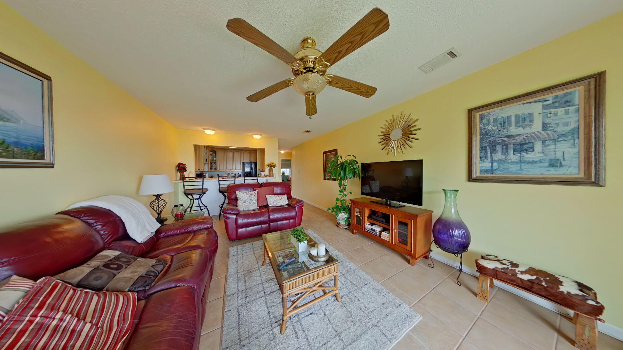 1695 Highway 98, Unit 102 Mary Esther, FL 32569 - Photo 7 of 27 a living room with furniture and a flat screen tv