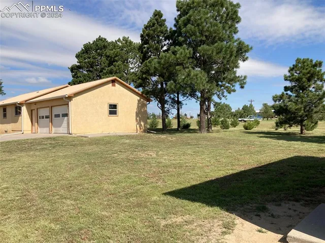 a backyard of a house with lots of green space