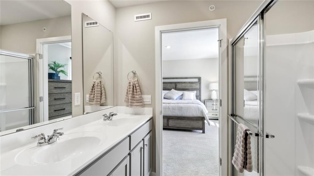 132 River Ridge Drive Coraopolis, PA 15108 - Photo 20 of 21 a en suite bathroom with a double vanity sink and mirror