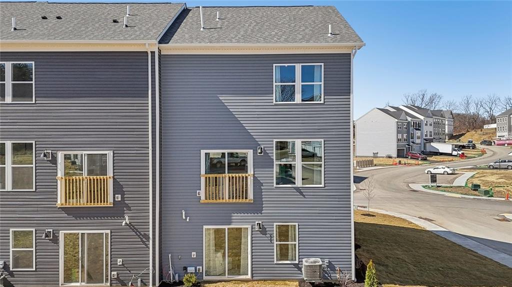 132 River Ridge Drive Coraopolis, PA 15108 - Photo 2 of 21 a view of a brick building next to a yard