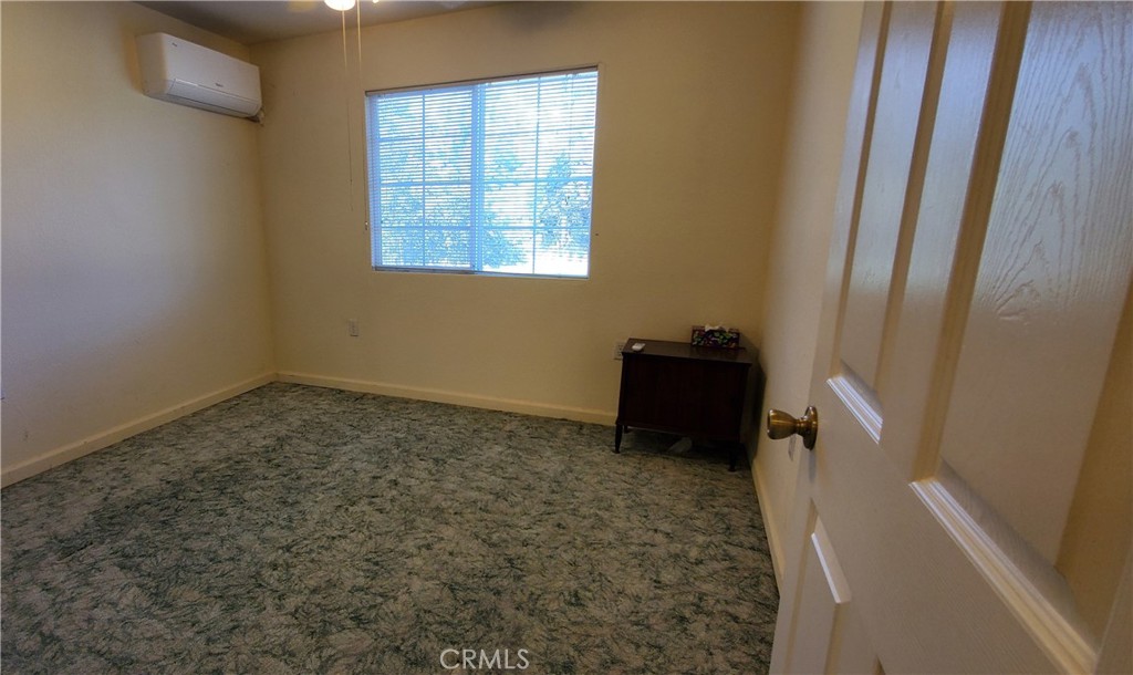 7486 Rodger Road Corning, CA 96021 - Photo 11 of 45 a bathroom with a sink a toilet and a vanity