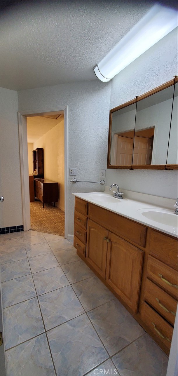 7486 Rodger Road Corning, CA 96021 - Photo 21 of 45 a spacious bathroom with a sink and a mirror