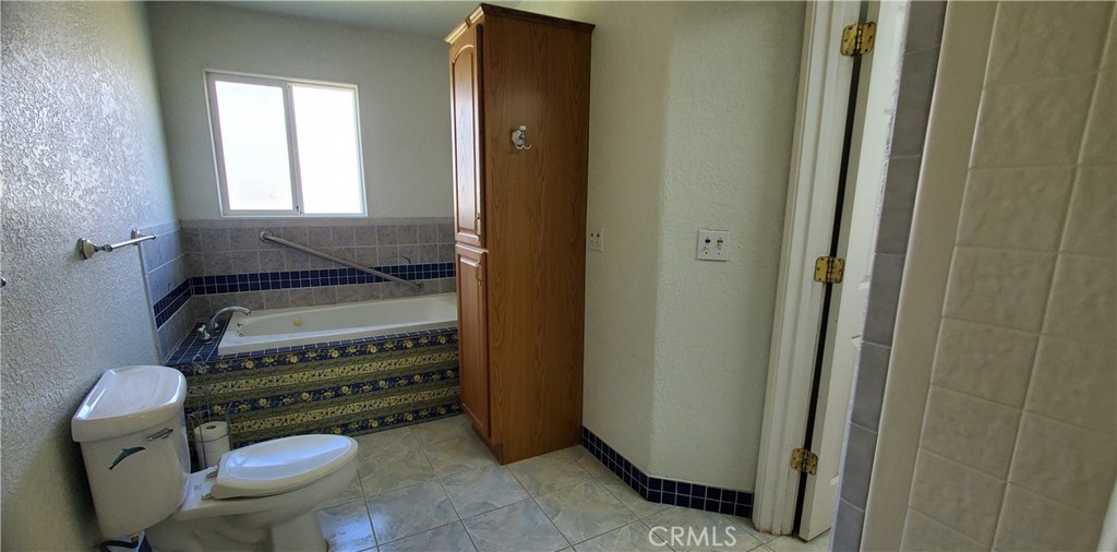7486 Rodger Road Corning, CA 96021 - Photo 23 of 45 a bathroom with a toilet and a sink
