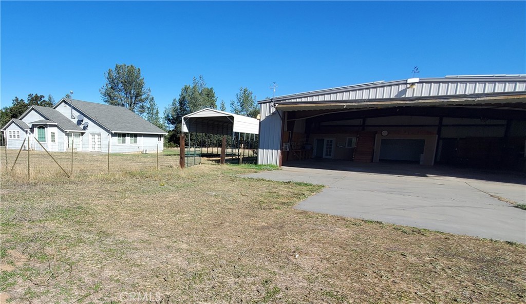 7486 Rodger Road Corning, CA 96021 - Photo 29 of 45 a view of a house with a yard and sitting area