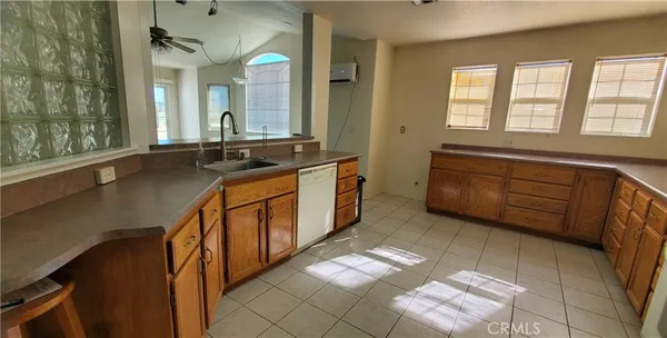 a spacious bathroom with a double vanity sink and a mirror