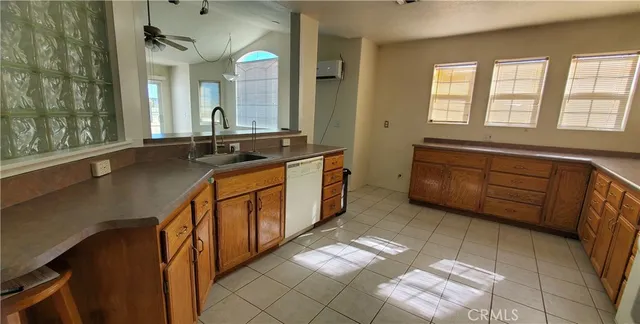 a spacious bathroom with a double vanity sink and a mirror