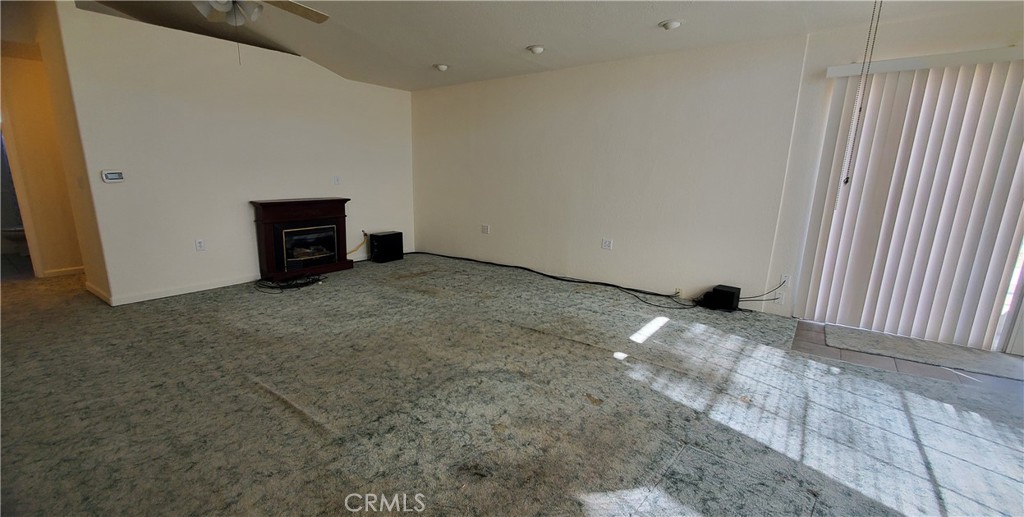 7486 Rodger Road Corning, CA 96021 - Photo 9 of 45 a view of an empty room with a fireplace