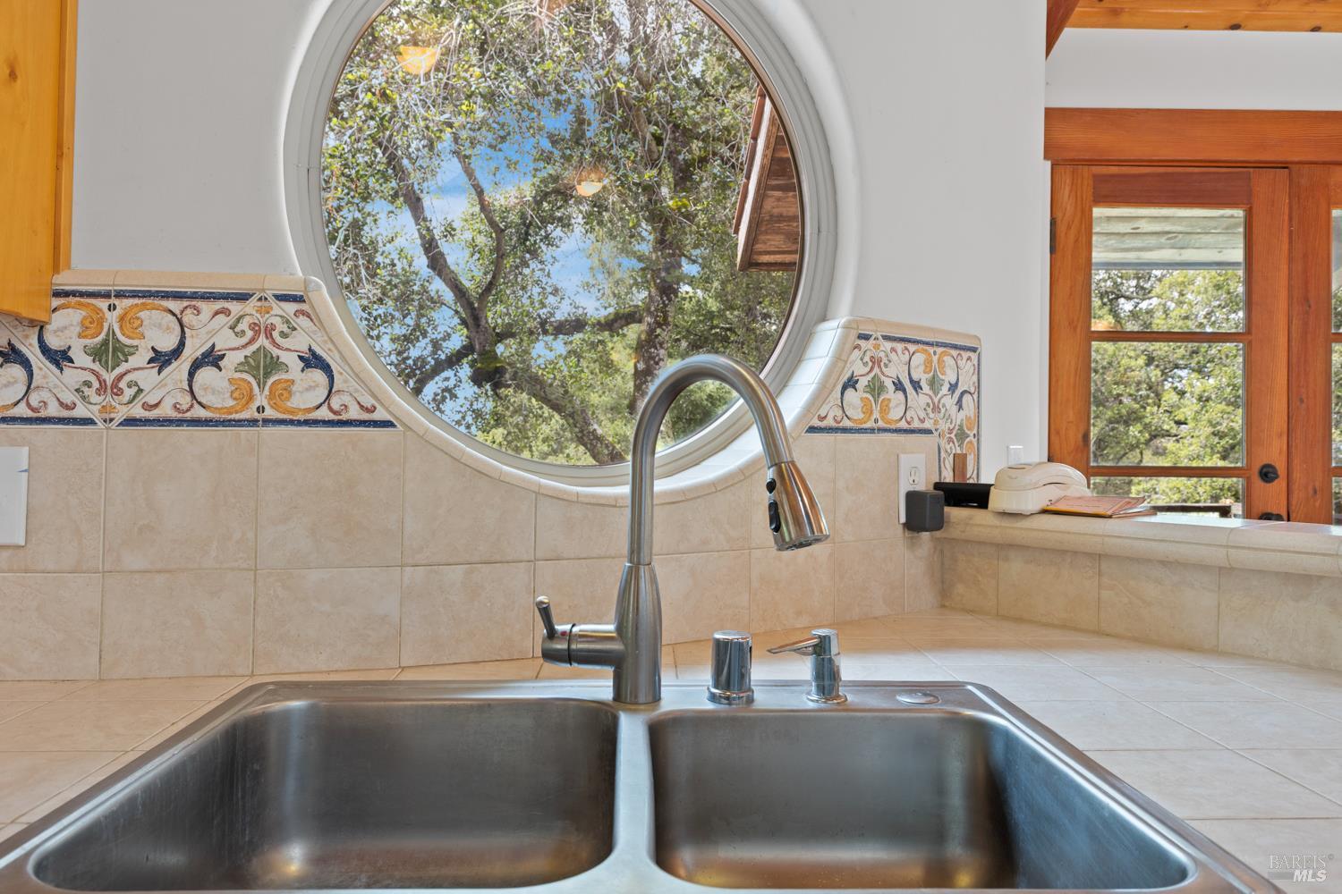 5262 Wikiup Court Santa Rosa, CA 95403 - Photo 11 of 56 a kitchen with a sink and a window