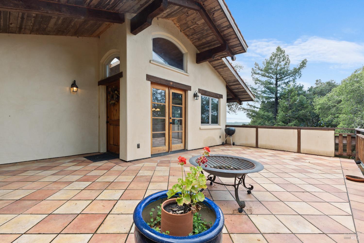 5262 Wikiup Court Santa Rosa, CA 95403 - Photo 2 of 56 a backyard of a house with fire pit and chairs