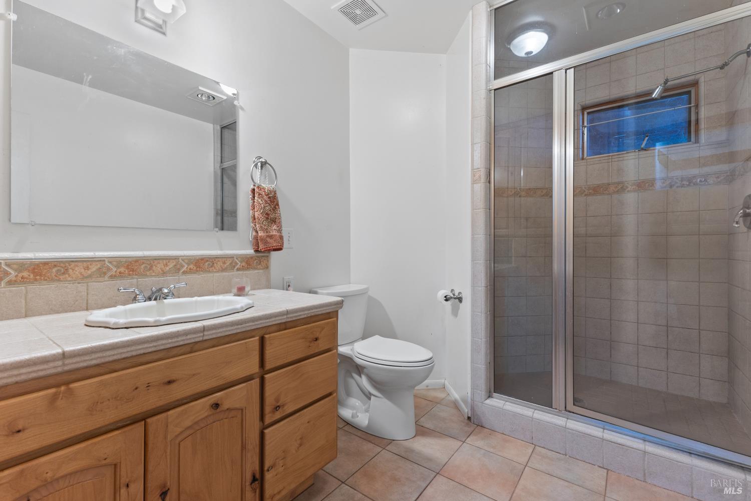 5262 Wikiup Court Santa Rosa, CA 95403 - Photo 25 of 56 a bathroom with a toilet sink and shower