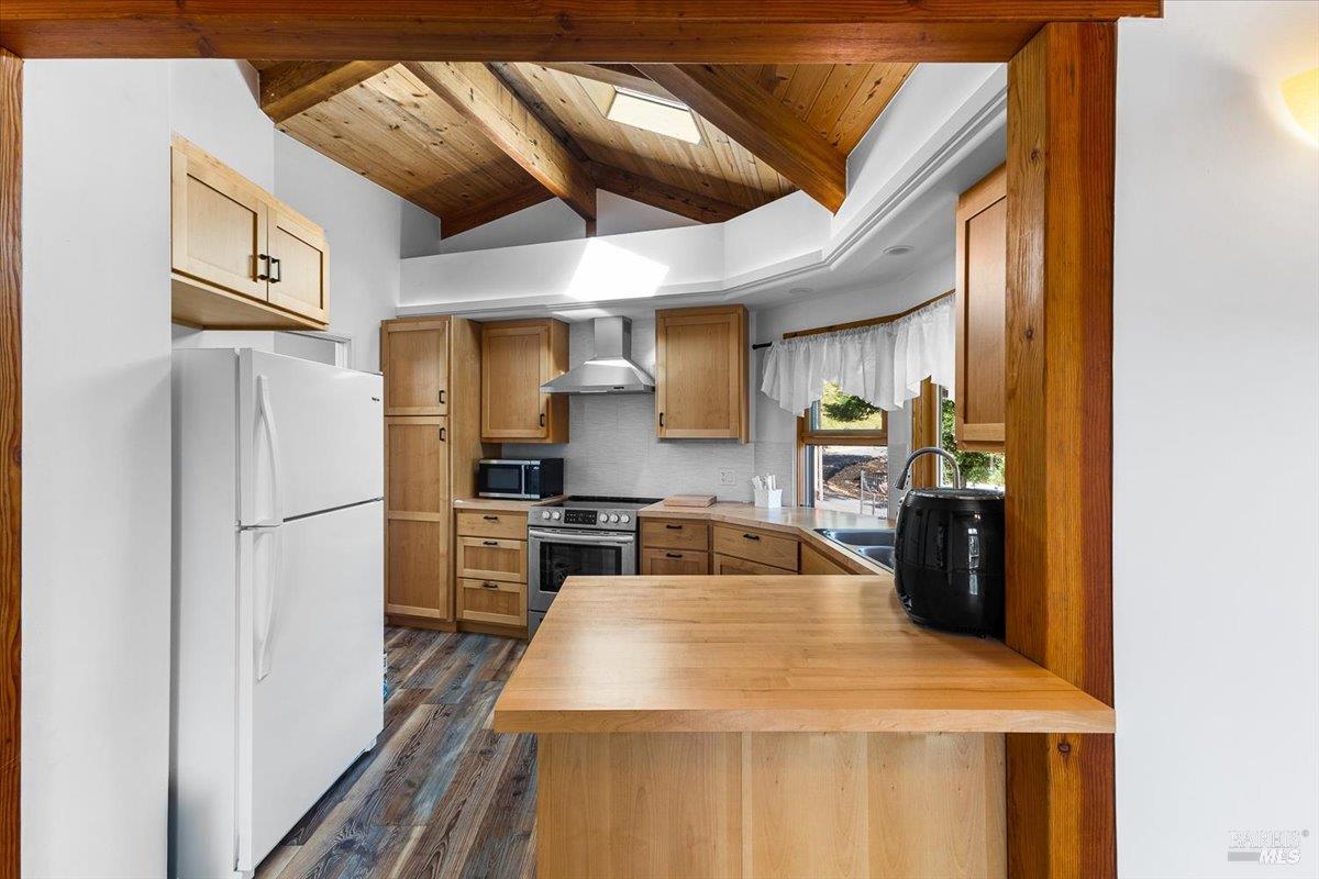 5262 Wikiup Court Santa Rosa, CA 95403 - Photo 30 of 43 a kitchen with a refrigerator a stove top oven a sink and dishwasher
