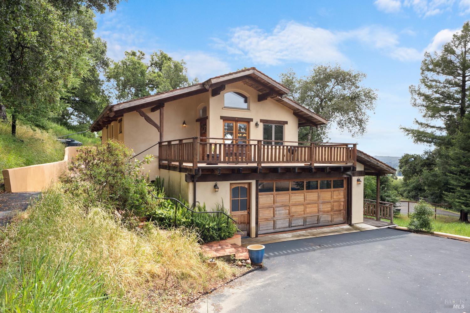5262 Wikiup Court Santa Rosa, CA 95403 - Photo 33 of 56 a front view of a house with a garden and trees