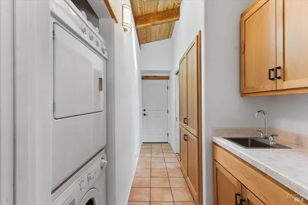 a kitchen with a sink and refrigerator