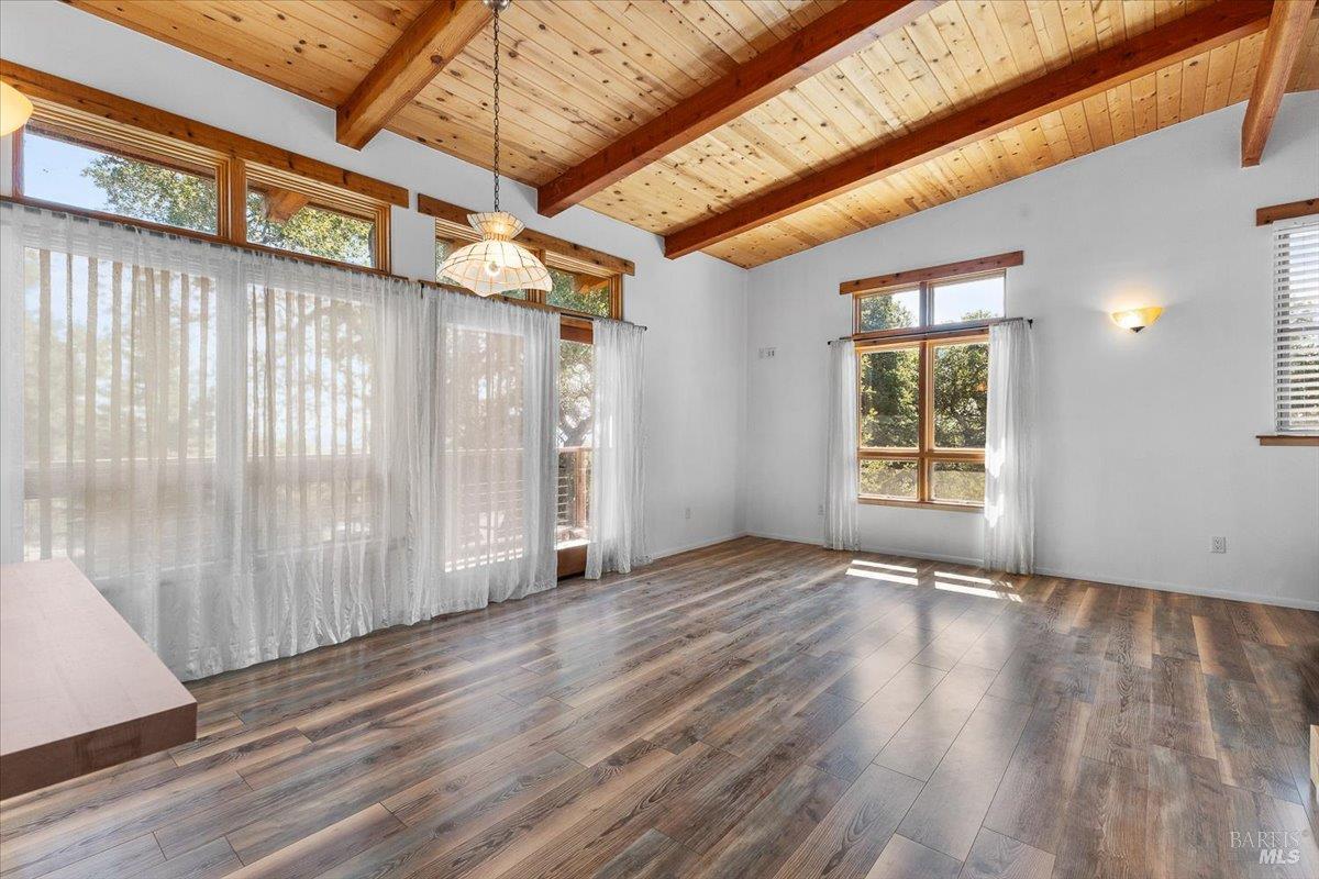5262 Wikiup Court Santa Rosa, CA 95403 - Photo 41 of 56 a view of an empty room with wooden floor and a window