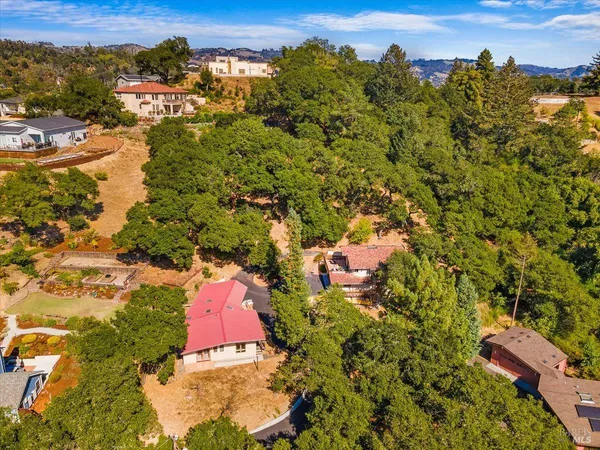 an aerial view of residential houses with outdoor space