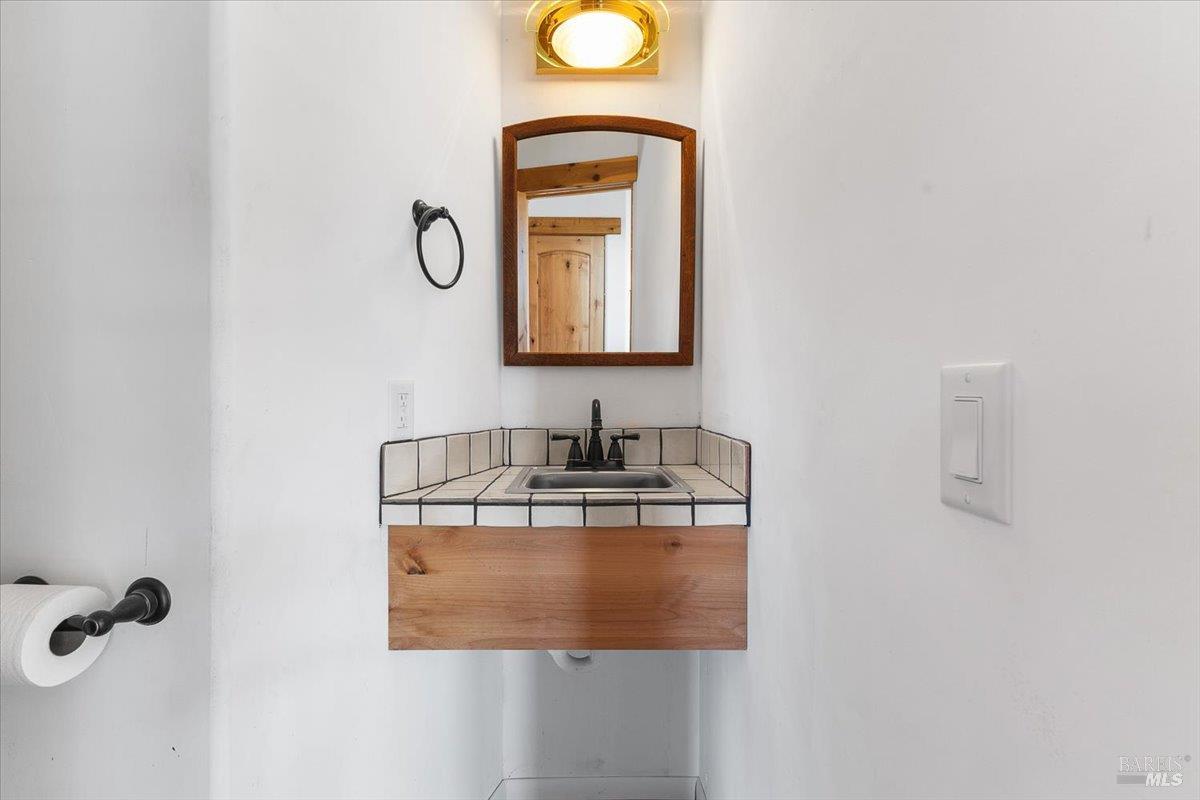 5262 Wikiup Court Santa Rosa, CA 95403 - Photo 43 of 56 a bathroom with a sink and a mirror