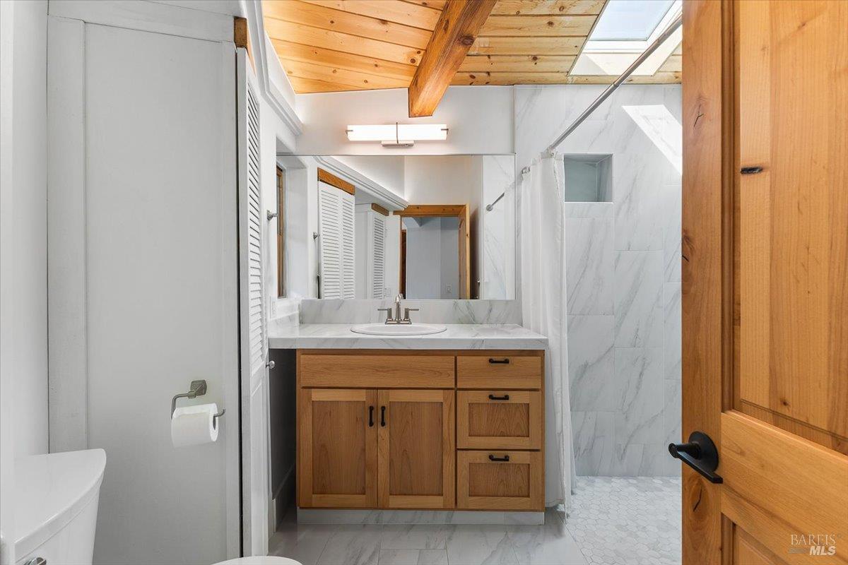 5262 Wikiup Court Santa Rosa, CA 95403 - Photo 47 of 56 a bathroom with a sink and a mirror
