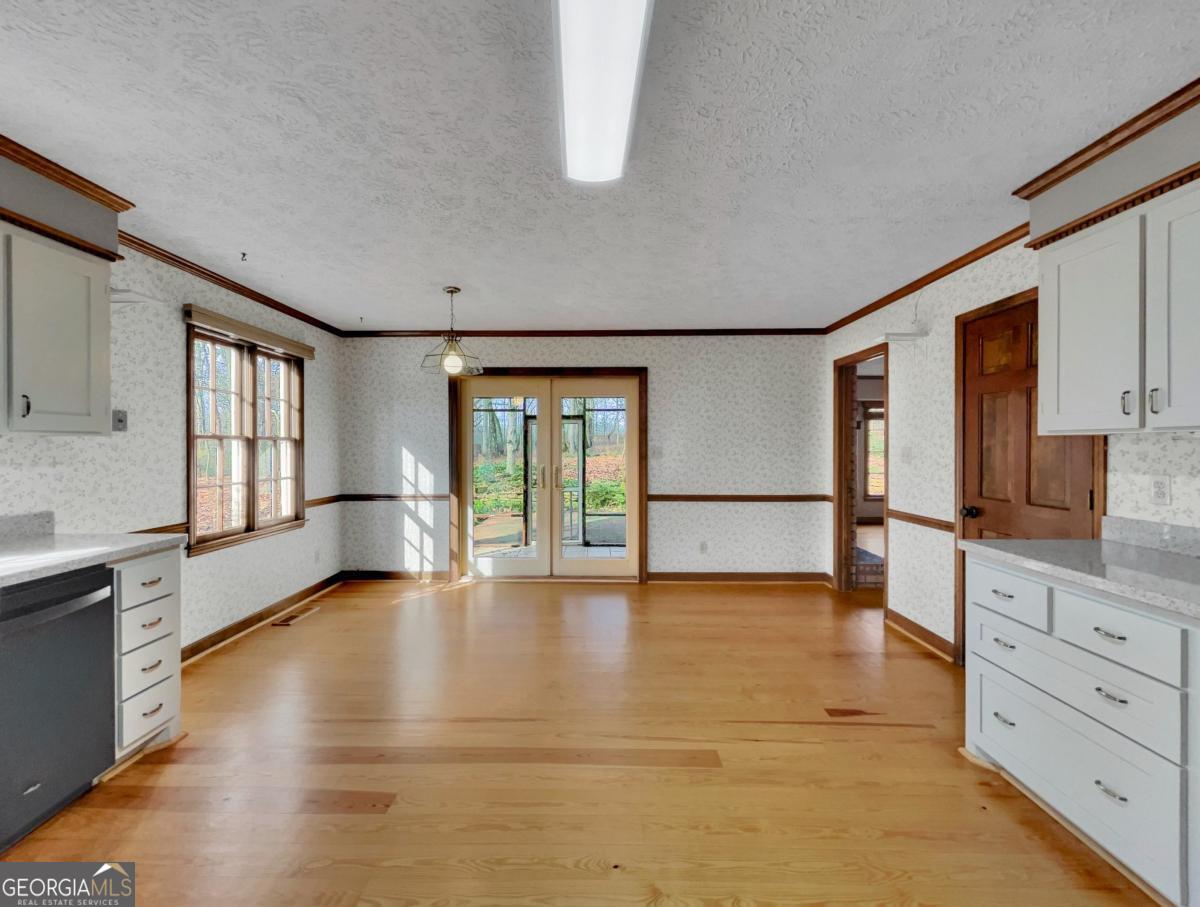 158 Lakeover Drive Athens, GA 30607 - Photo 13 of 48 a view of an empty room with window and cabinet