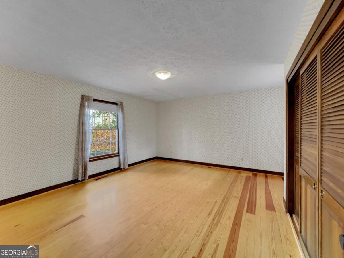 158 Lakeover Drive Athens, GA 30607 - Photo 15 of 48 a view of an empty room and a window
