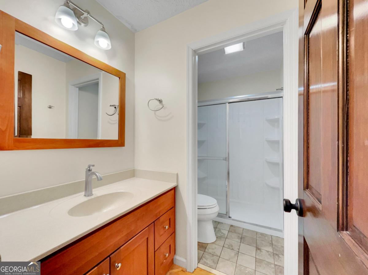158 Lakeover Drive Athens, GA 30607 - Photo 17 of 48 a bathroom with a sink toilet and shower