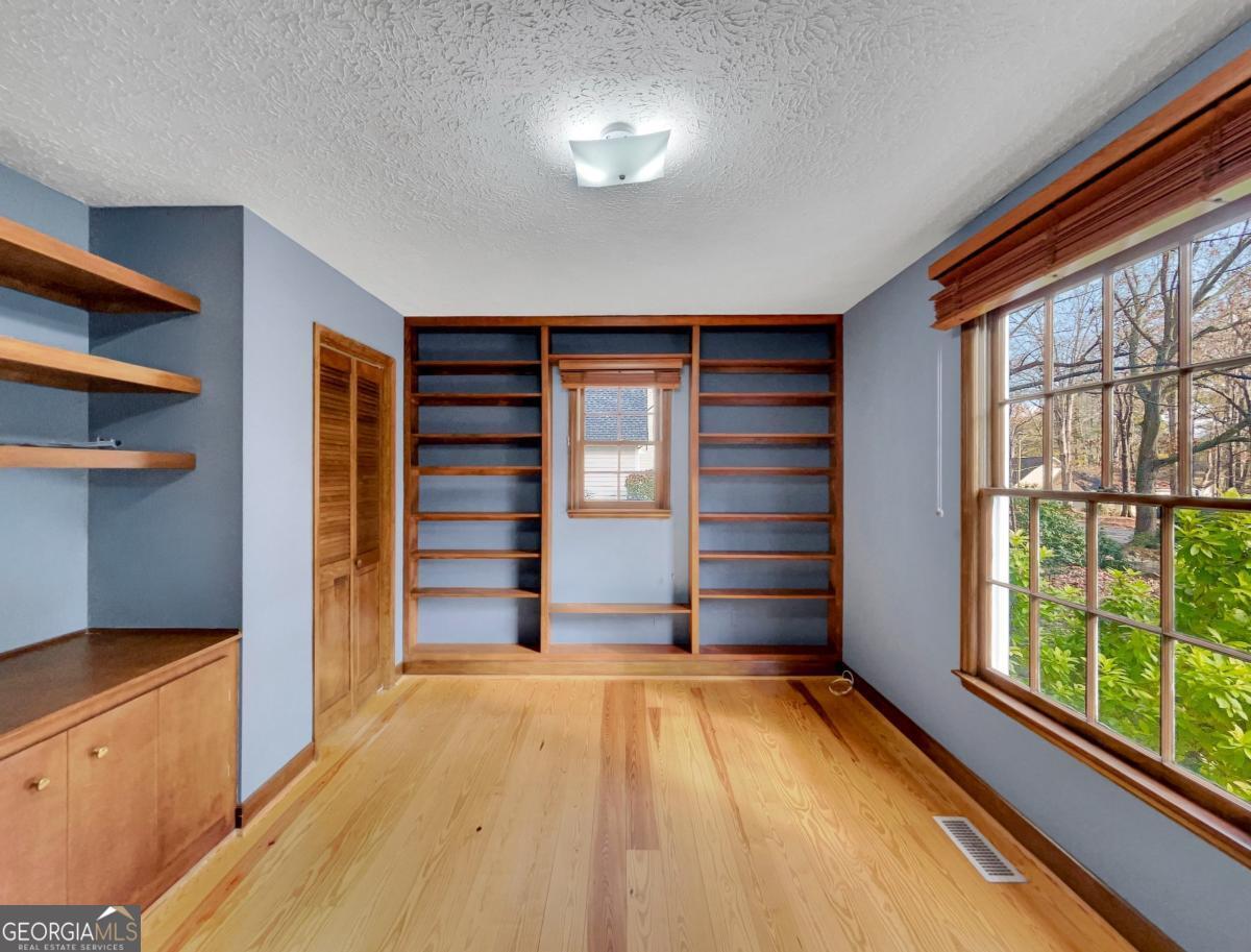 158 Lakeover Drive Athens, GA 30607 - Photo 18 of 48 a view of room with walk in closet and window