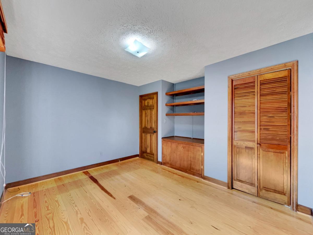 158 Lakeover Drive Athens, GA 30607 - Photo 19 of 48 an empty room with closet area