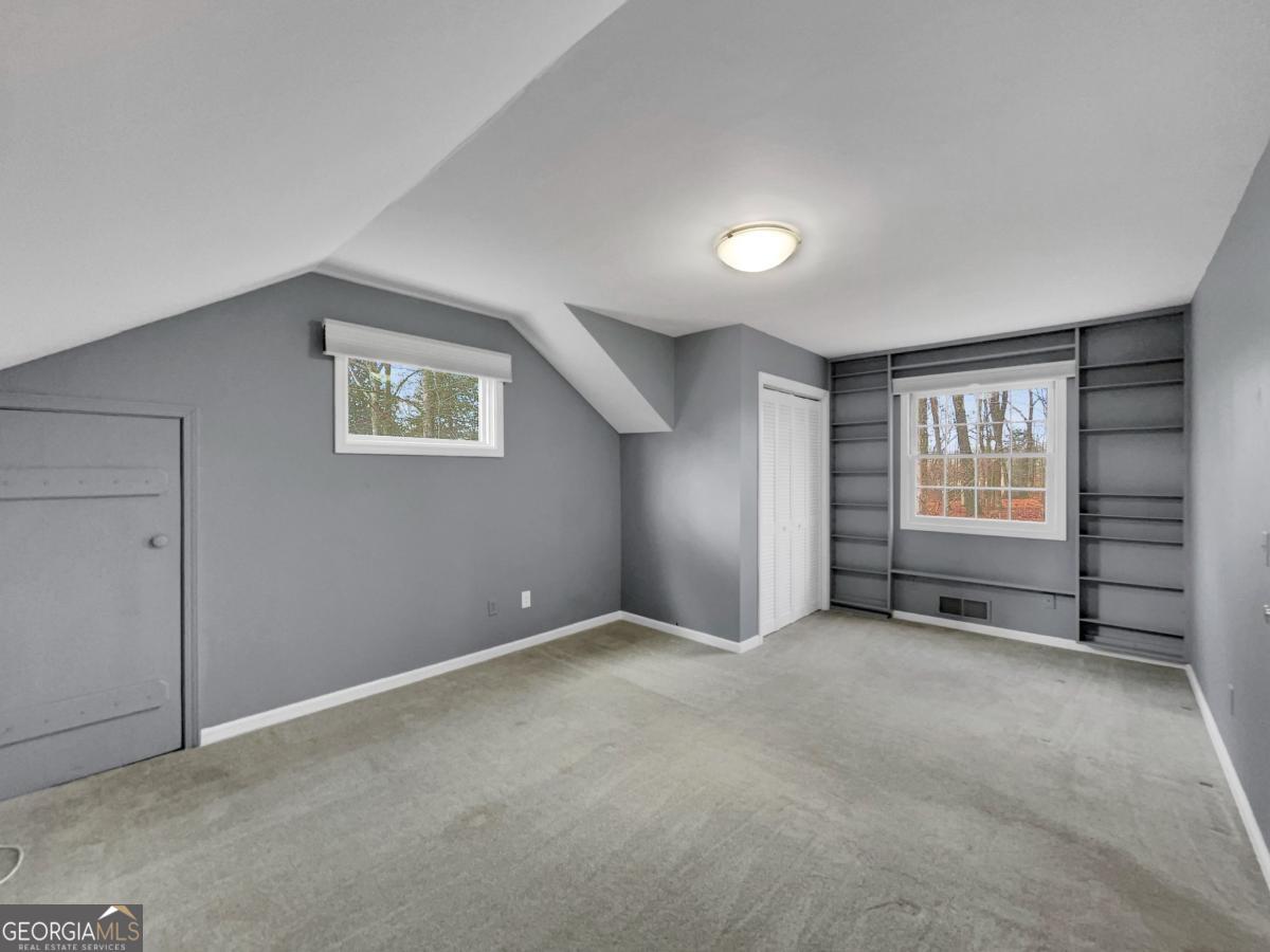 158 Lakeover Drive Athens, GA 30607 - Photo 21 of 48 an empty room with windows and closet