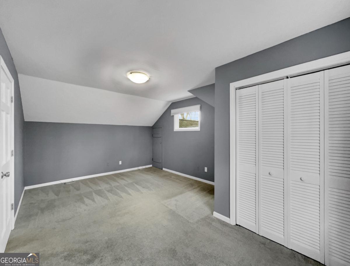 158 Lakeover Drive Athens, GA 30607 - Photo 22 of 48 an empty room with windows