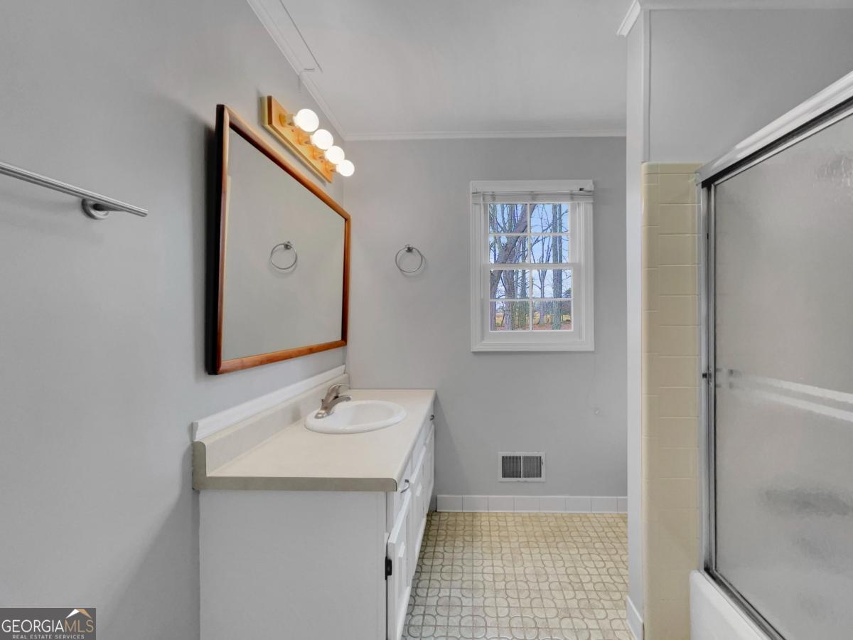 158 Lakeover Drive Athens, GA 30607 - Photo 23 of 48 a bathroom with a sink a mirror and a toilet
