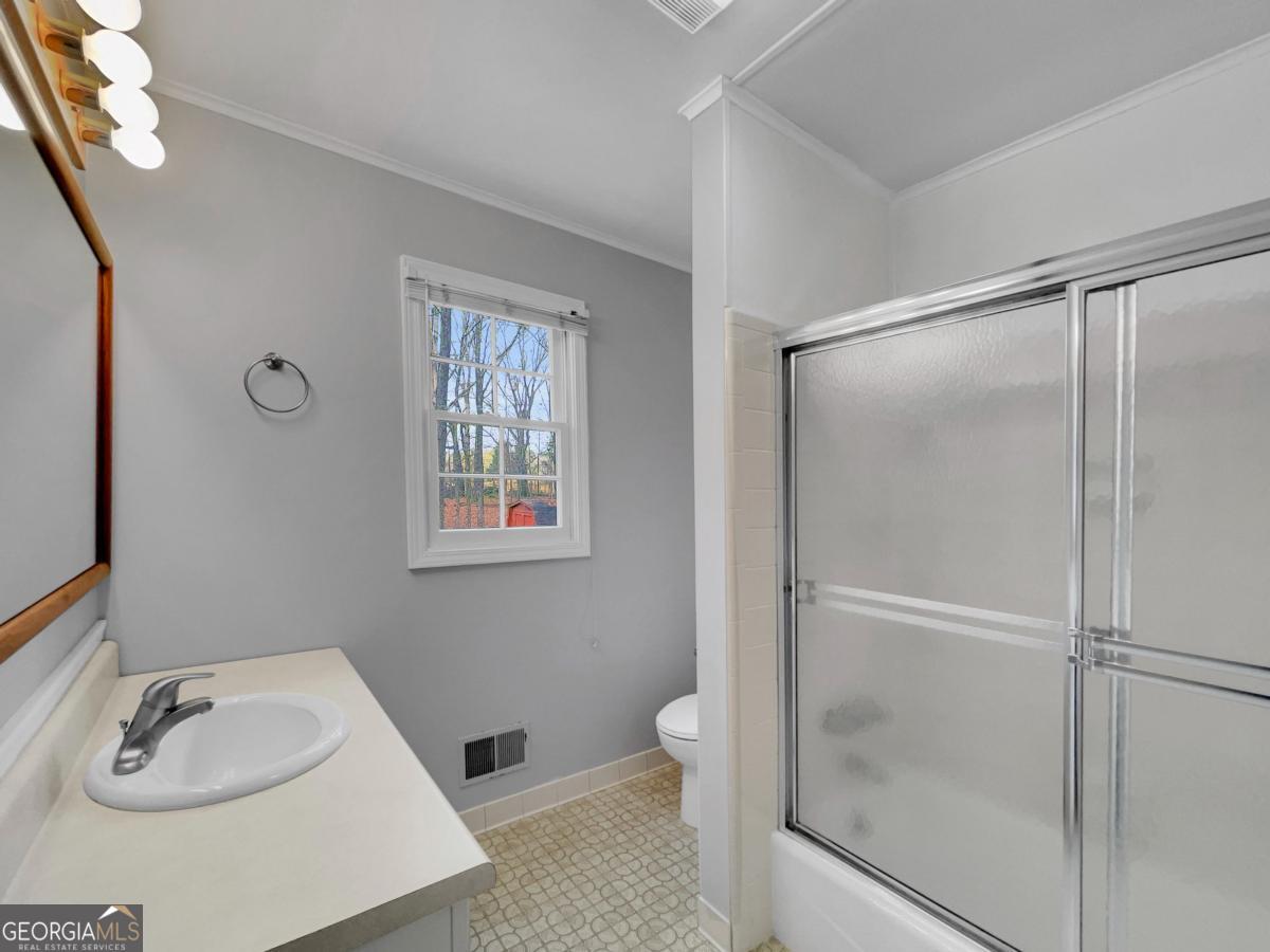 158 Lakeover Drive Athens, GA 30607 - Photo 24 of 48 a bathroom with a sink and a mirror