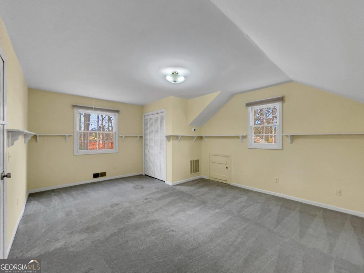 158 Lakeover Drive Athens, GA 30607 - Photo 25 of 48 an empty room with windows