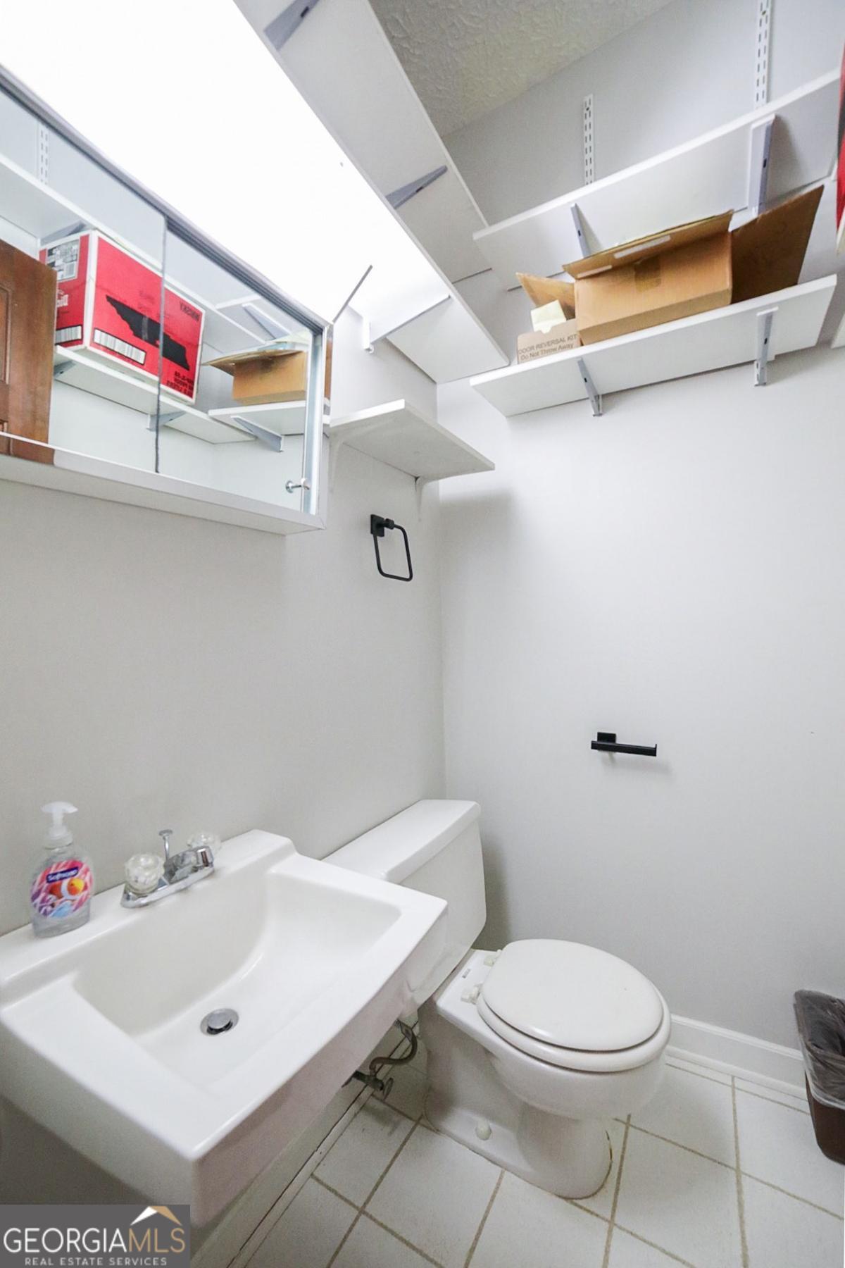 158 Lakeover Drive Athens, GA 30607 - Photo 28 of 48 a bathroom with a sink and a toilet