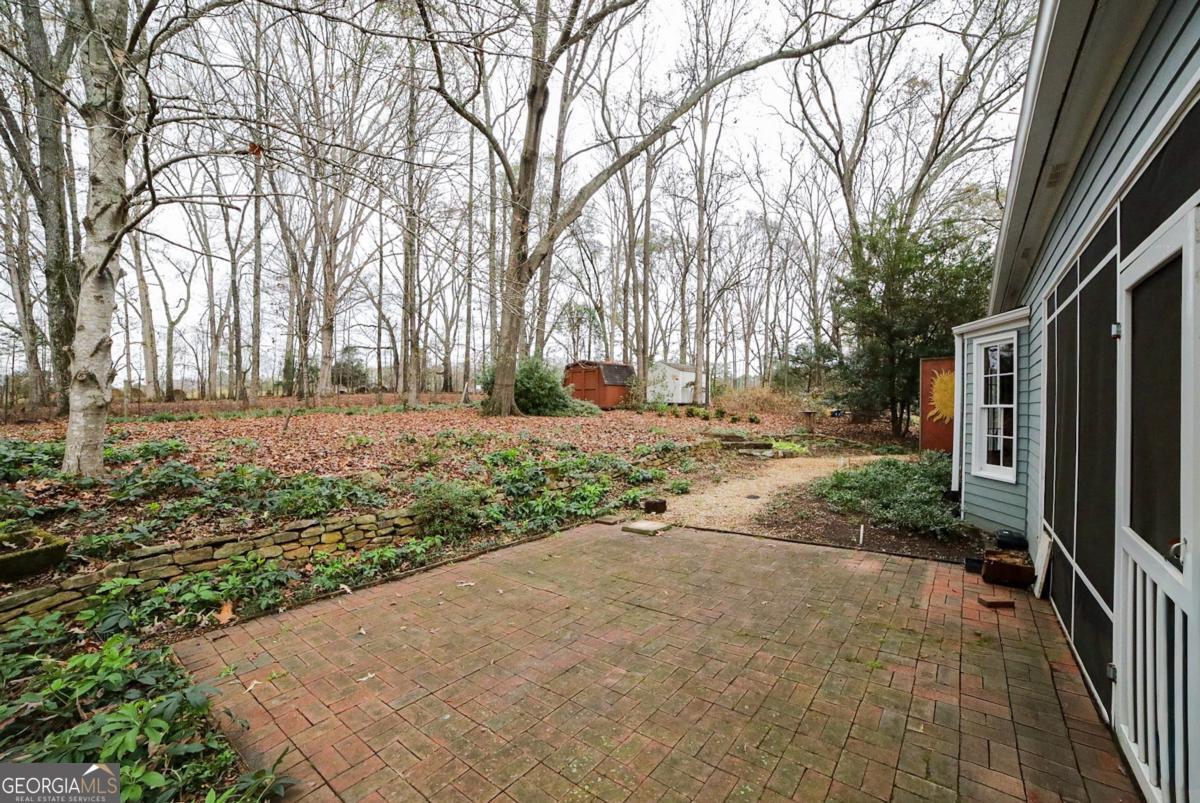 158 Lakeover Drive Athens, GA 30607 - Photo 32 of 48 a view of a yard with plants and trees
