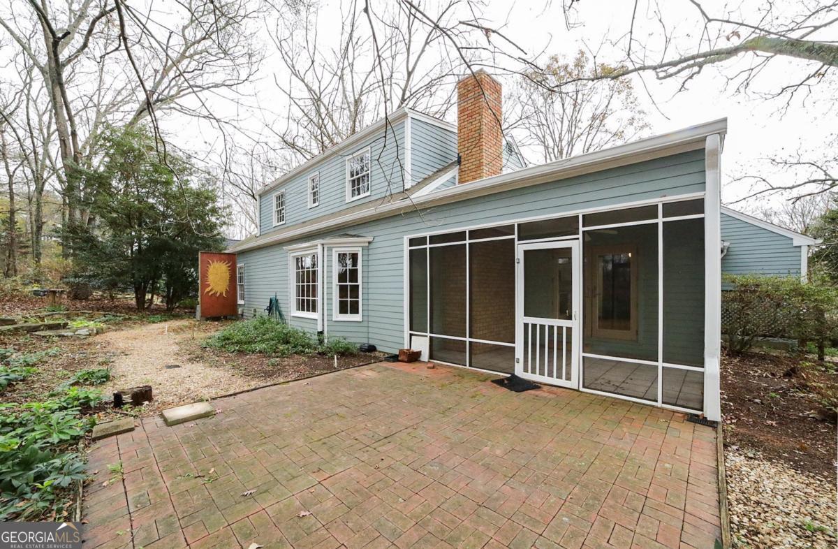 158 Lakeover Drive Athens, GA 30607 - Photo 33 of 48 a view of house with a large window and potted plants