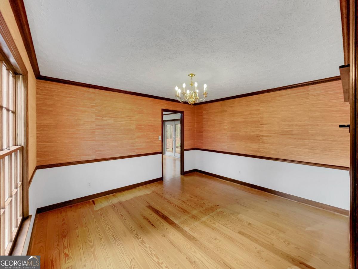158 Lakeover Drive Athens, GA 30607 - Photo 4 of 48 a view of an empty room with a window
