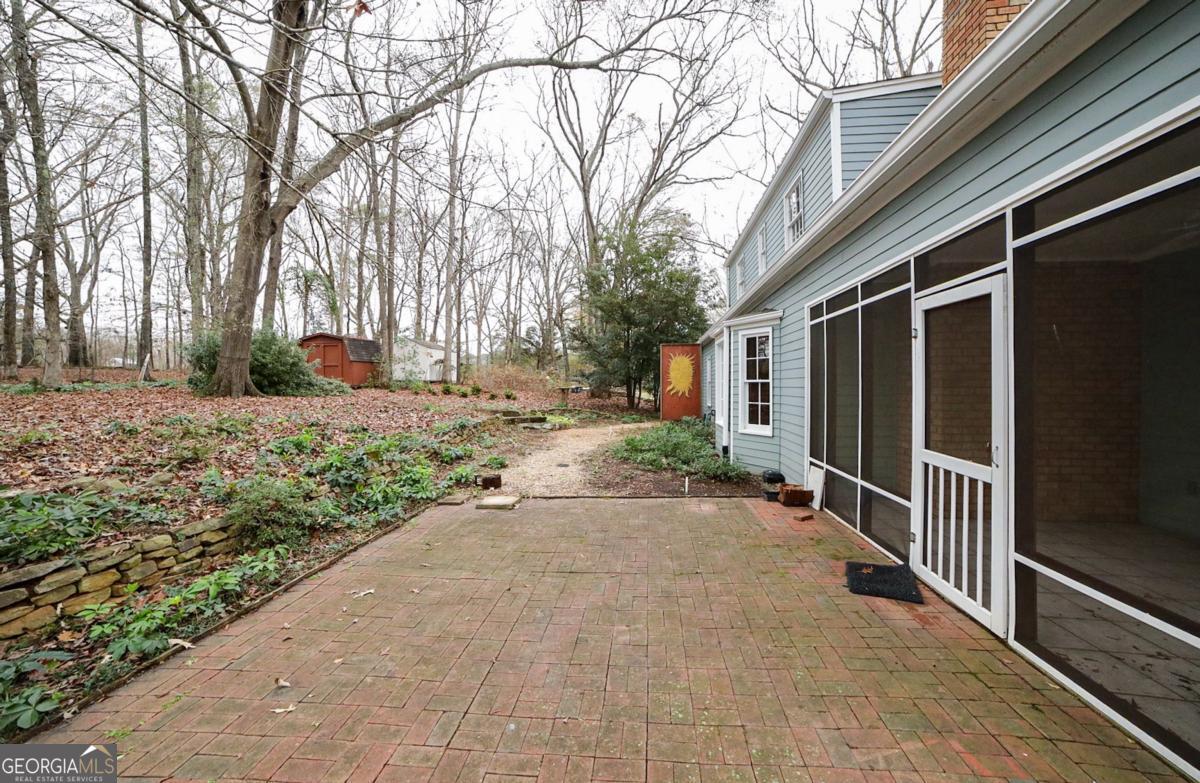 158 Lakeover Drive Athens, GA 30607 - Photo 42 of 48 a view of a backyard with large trees and wooden fence