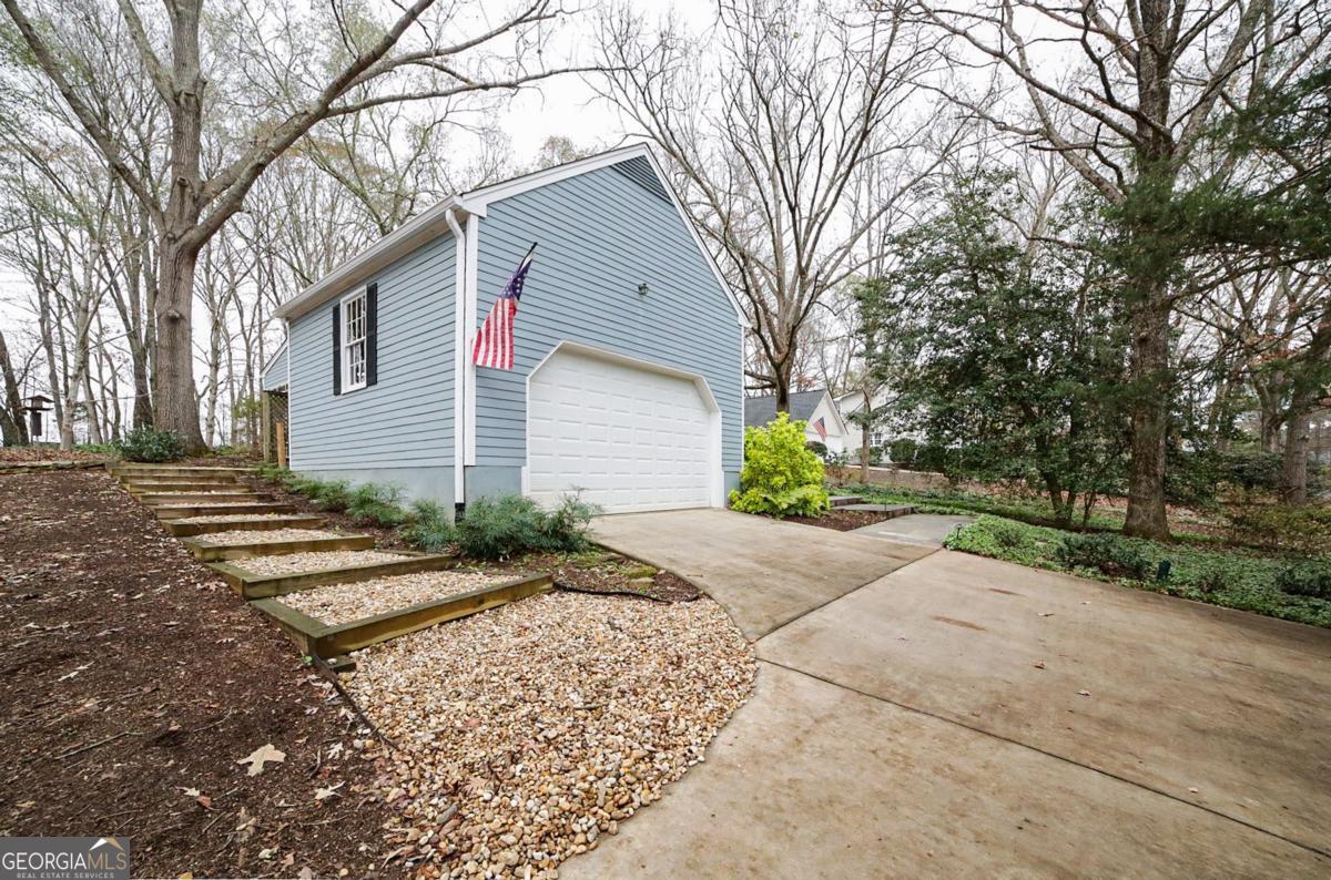 158 Lakeover Drive Athens, GA 30607 - Photo 44 of 48 a front view of a house with a yard and a garage