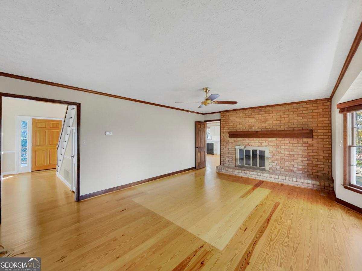 158 Lakeover Drive Athens, GA 30607 - Photo 7 of 48 wooden floor in an empty room with a window