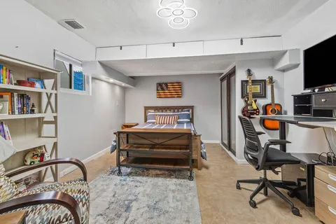 a view of a workspace with furniture