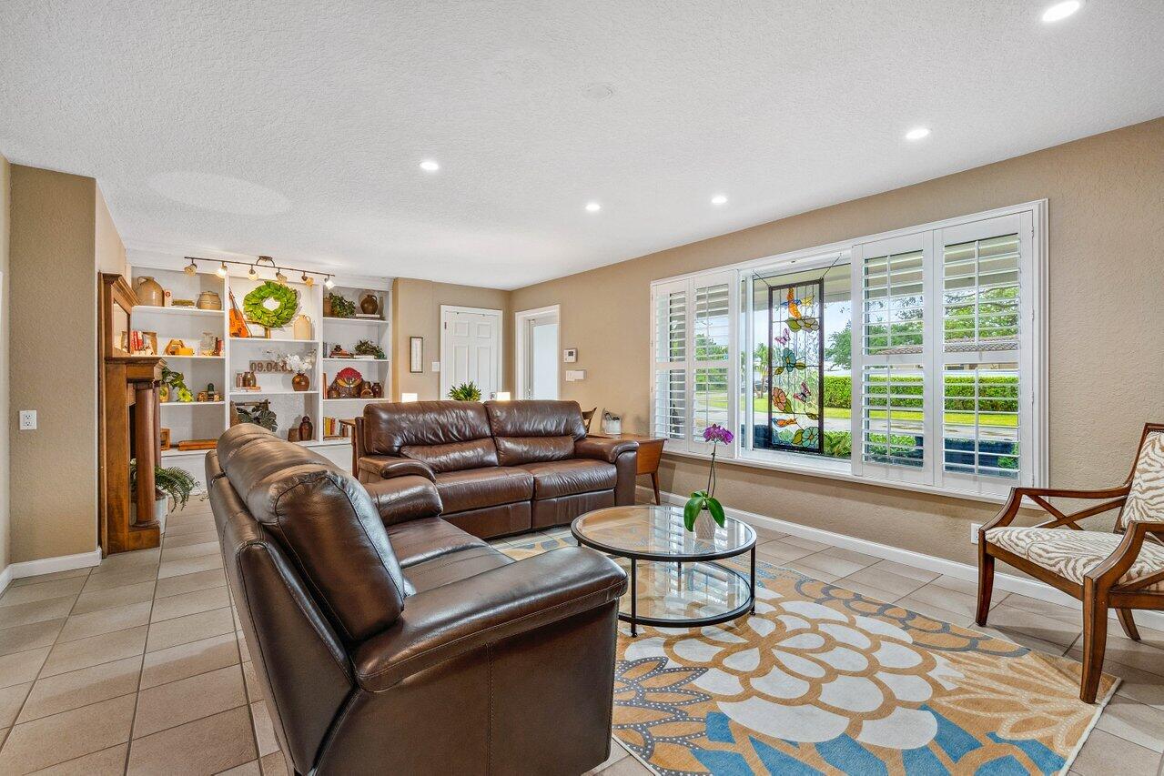 5131 Northeast 27th Terrace Lighthouse Point, FL 33064 - Photo 3 of 39 a living room with furniture and a large window