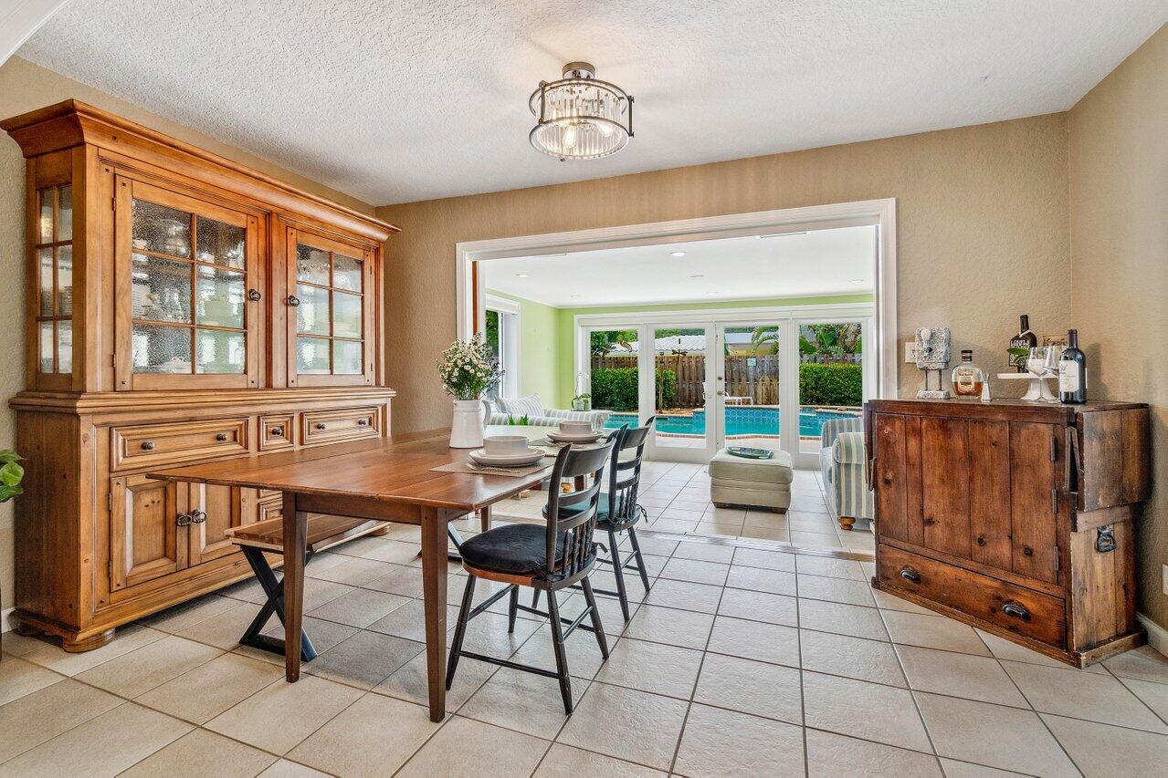 5131 Northeast 27th Terrace Lighthouse Point, FL 33064 - Photo 6 of 39 a dining room with furniture and window
