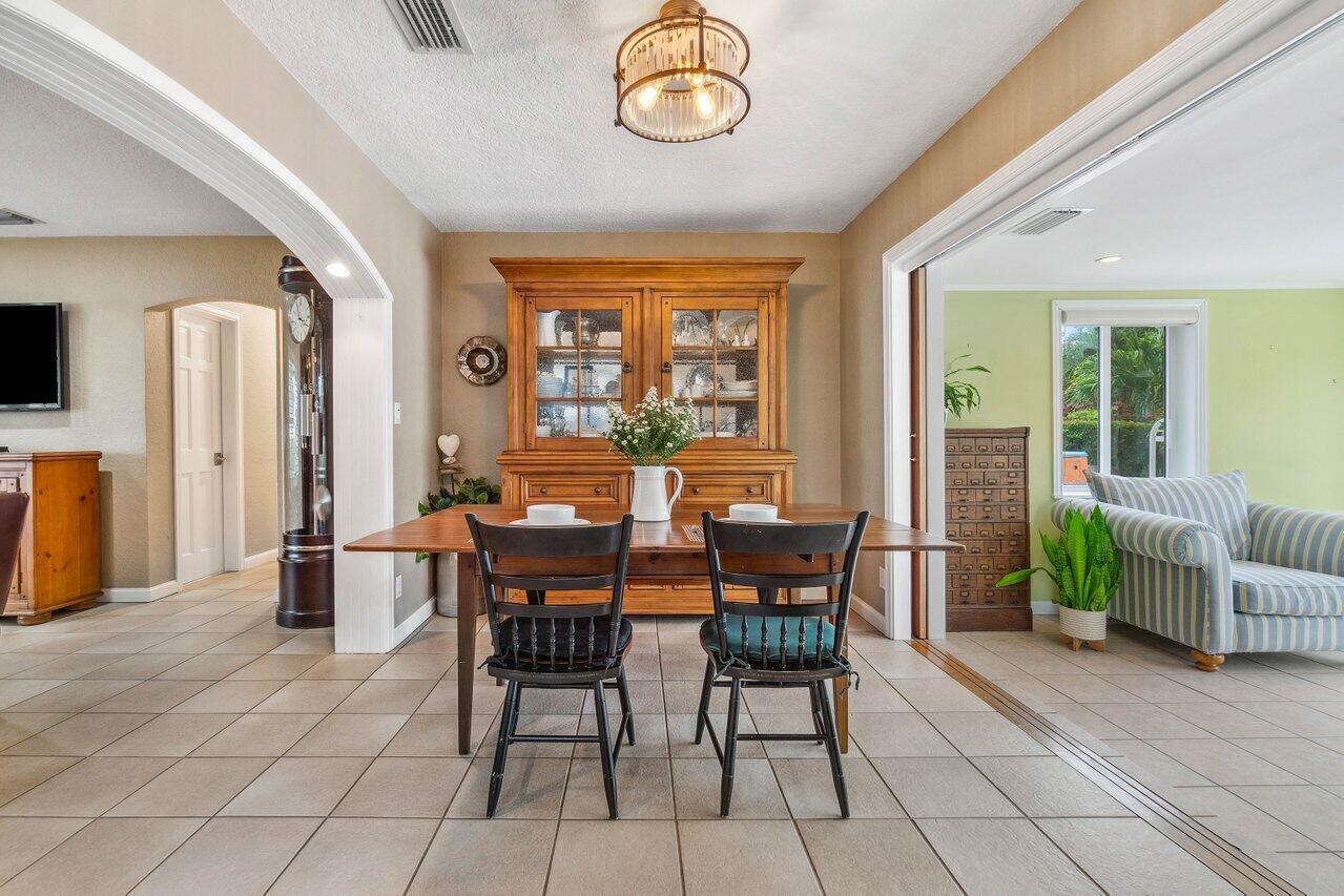 5131 Northeast 27th Terrace Lighthouse Point, FL 33064 - Photo 7 of 39 a dining room with furniture and window