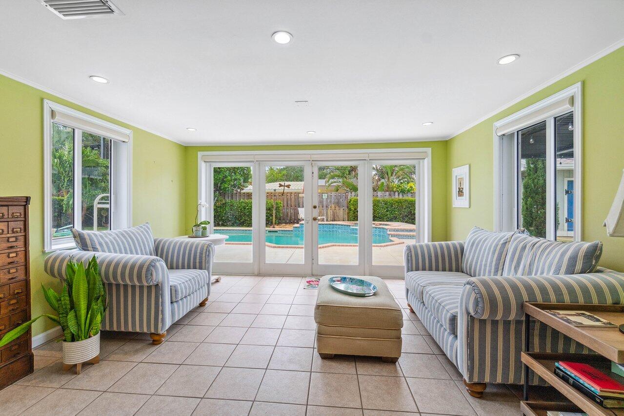 5131 Northeast 27th Terrace Lighthouse Point, FL 33064 - Photo 8 of 39 a living room with furniture and a large window