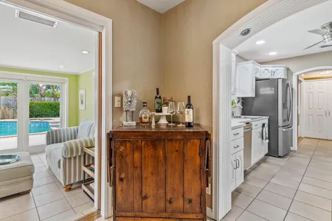 a kitchen with stainless steel appliances kitchen island granite countertop a stove and a sink