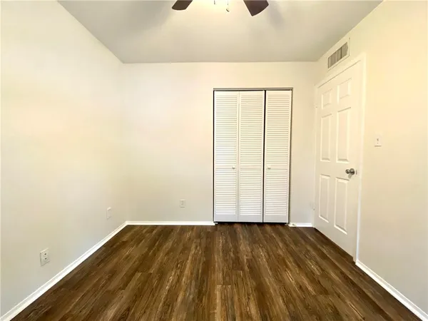 an empty room with wooden floor